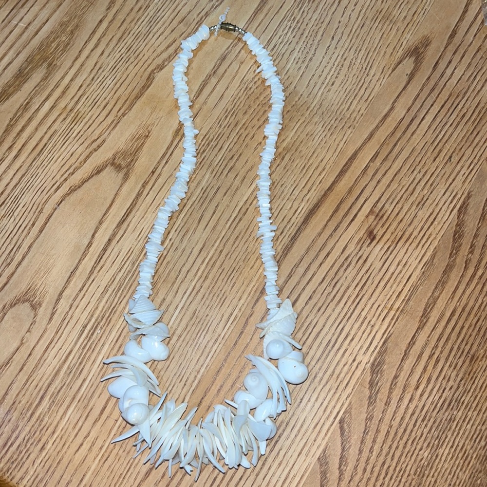Seashell necklace, 24” in length, screw closure.
